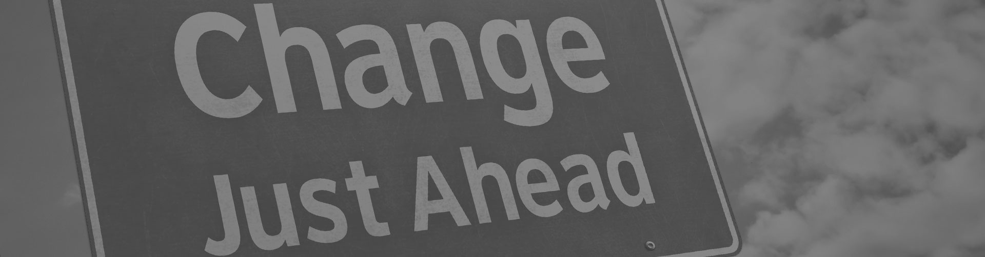 Signpost that reads change just ahead.
